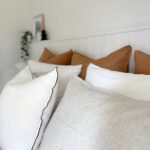 Stylishly decorated bed with pillows from the Keysborough bedroom project.