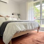 Stylish bedroom in the Keysborough Project with natural light and neutral tones.