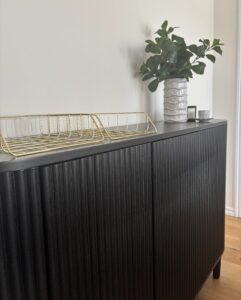 Modern black cabinet with plant and gold dish rack, Keilor Project