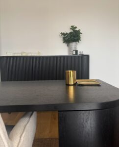 Modern decor in Keilor Project Gallery with black furniture.