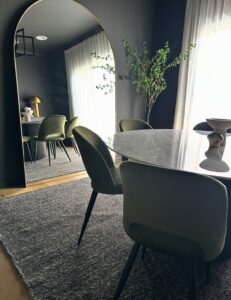 Elegant dining room with mirror at Keilor Project Gallery