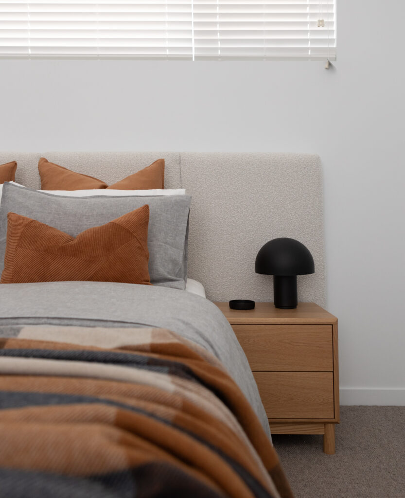 Modern bedroom with wooden side table and stylish decor