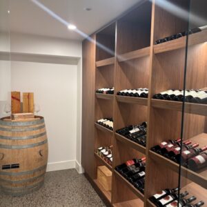 Luxury home wine cellar with wooden shelves in Essendon West project