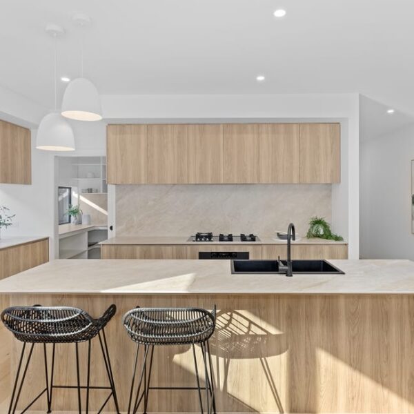 Modern kitchen interior with wooden finishes and island.