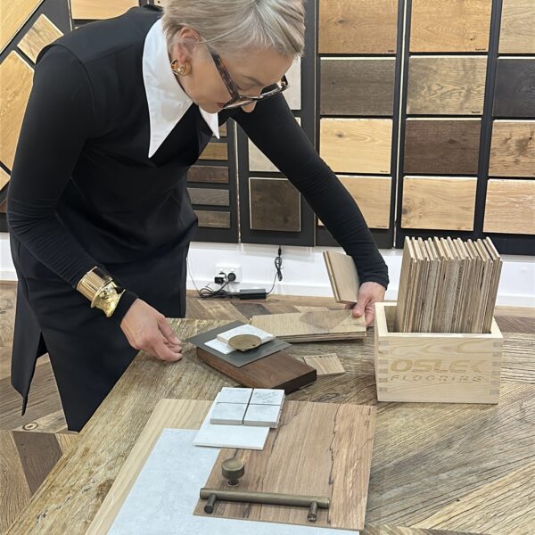 Interior designer examining wood samples in gallery
