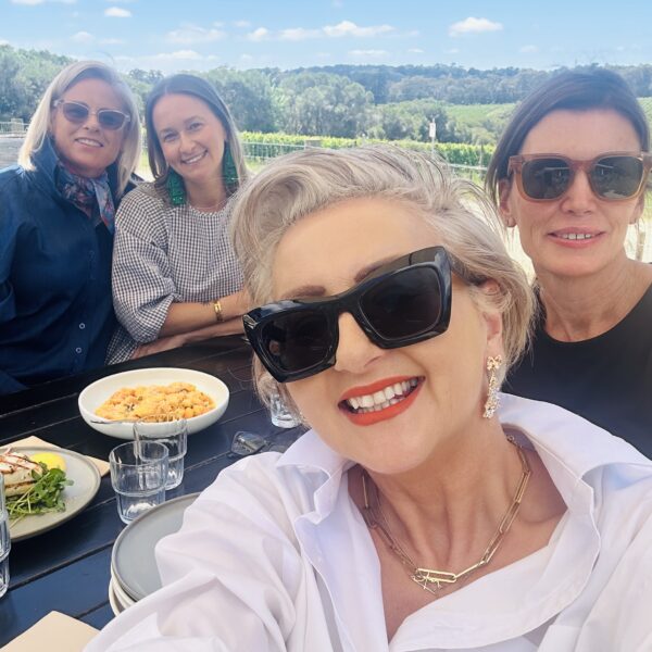 Group enjoying meal outdoors, interior design gallery context