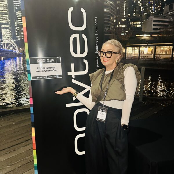 Woman at Polytec event in Melbourne showcasing interior design innovations.