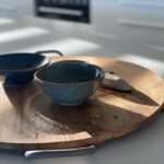 Ceramic bowls on wooden board in Peterborough Project gallery