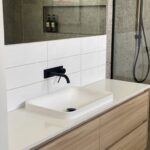Modern bathroom sink with wood cabinetry in Peterborough Project gallery.
