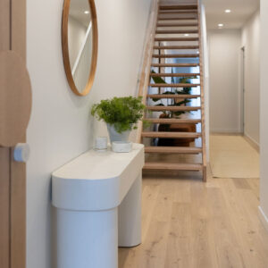 Stylish interior of a beachside townhouse with plants and modern decor