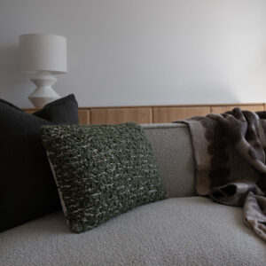 Contemporary living room in beachside townhouse with textured cushions