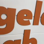 Close-up of Gelato Lab signage, focusing on letters.