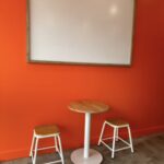 Interior of Gelato Lab Gallery featuring vibrant orange decor.