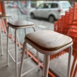 Interior view of Gelato Lab Gallery with stools and street view